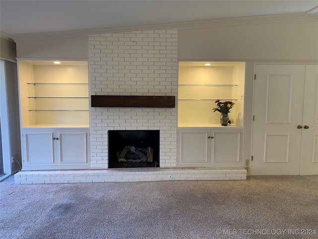 unfurnished living room featuring built in shelves, carpet floors, a fireplace, and lofted ceiling