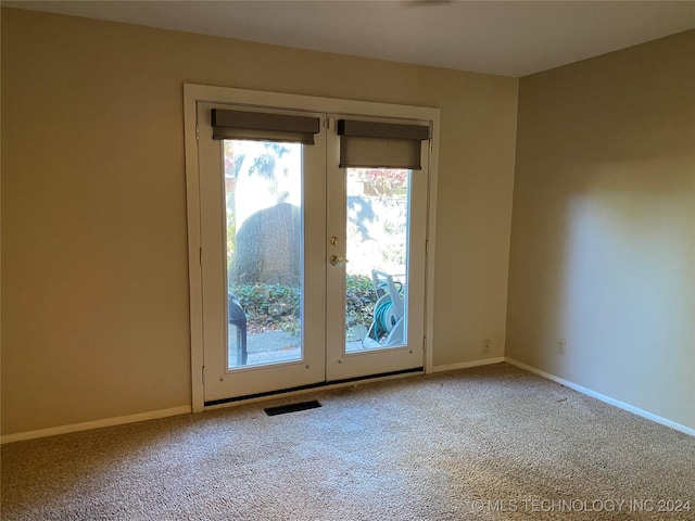 entryway featuring carpet flooring and french doors