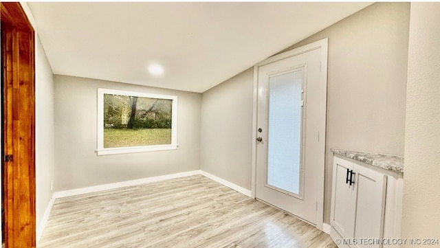 foyer with light wood-type flooring