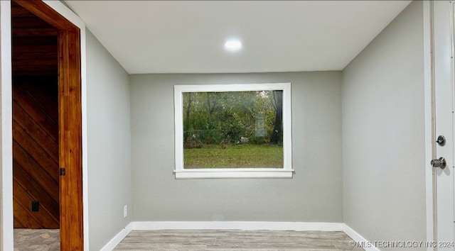 spare room with light hardwood / wood-style floors