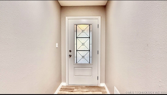 doorway with light hardwood / wood-style floors