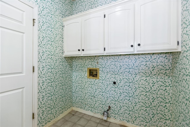 laundry room with cabinets, hookup for a washing machine, and electric dryer hookup