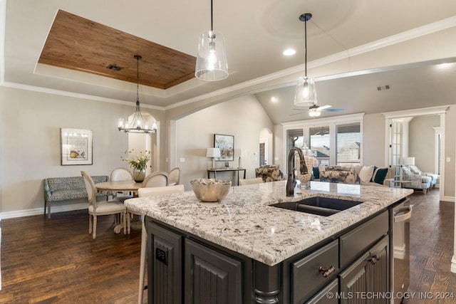 7916 N 145th E Ct, Owasso, OK 74055 - kitchen with open floor plan, a ceiling fan, light stone counters, dark wood-style floors, and a center island with sink