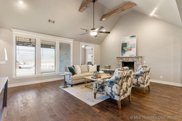 living room featuring a fireplace, dark hardwood / wood-style floors, ceiling fan, and beamed ceiling