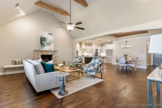 living room featuring a fireplace, lofted ceiling with beams, dark hardwood / wood-style floors, and ceiling fan with notable chandelier