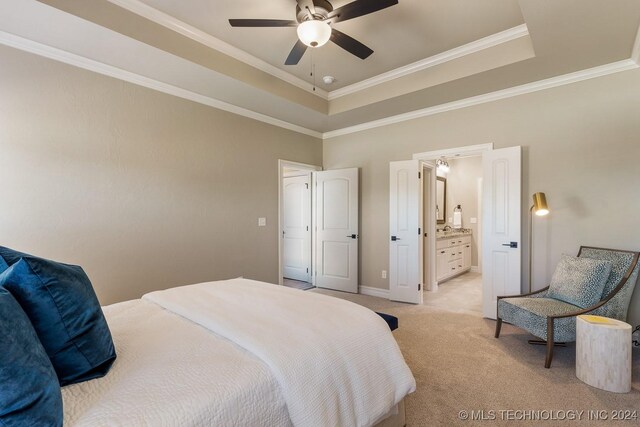 7916 N 145th E Ct, Owasso, OK 74055 - bedroom with a tray ceiling, light colored carpet, ornamental molding, ceiling fan, and ensuite bathroom