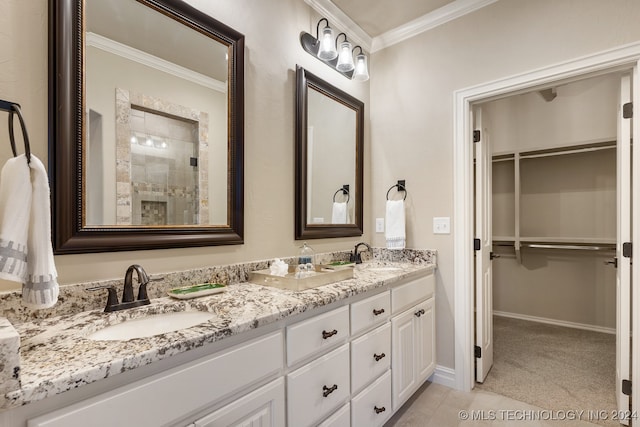 bathroom with crown molding, tile patterned flooring, and vanity