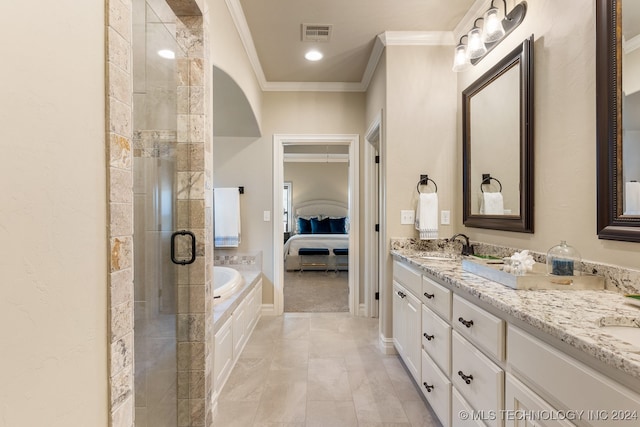 bathroom featuring crown molding, vanity, and shower with separate bathtub