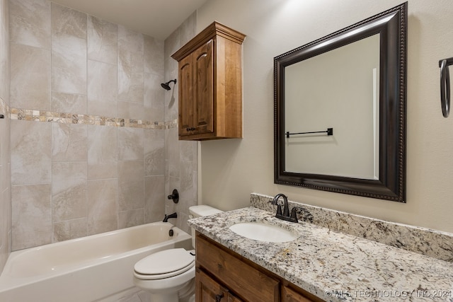 full bathroom with vanity, tiled shower / bath combo, and toilet