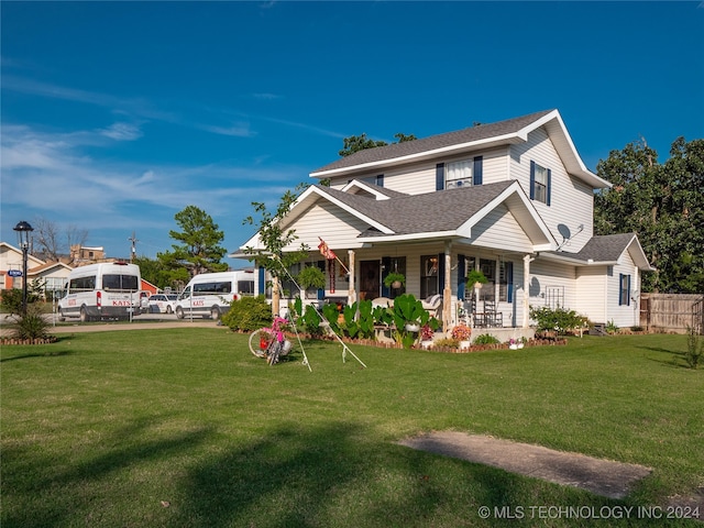 view of front of home featuring a porch and a front yard