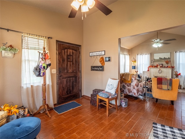 foyer entrance featuring hardwood / wood-style flooring, ceiling fan, and lofted ceiling