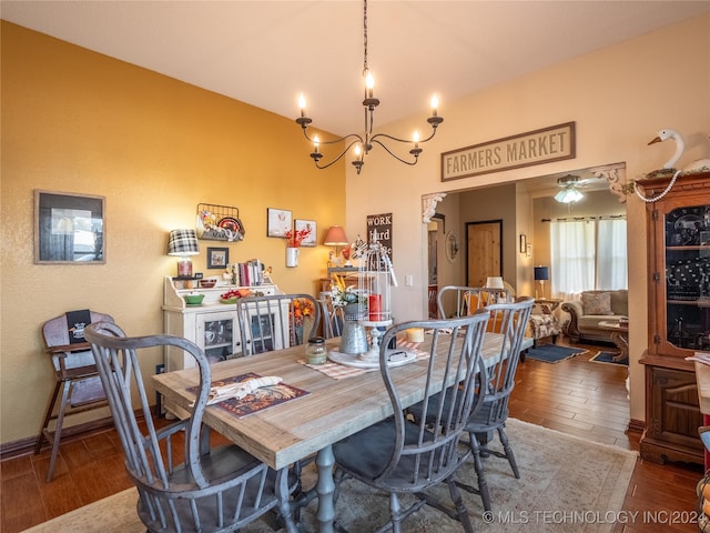 dining space featuring a notable chandelier and wood-type flooring