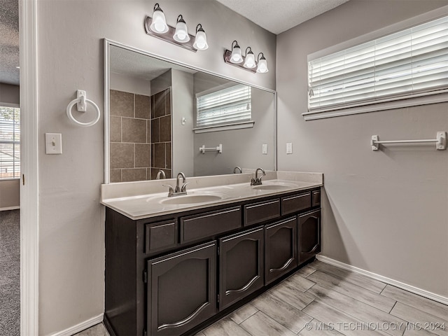 bathroom with vanity and a textured ceiling