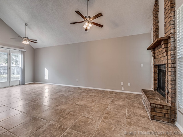 unfurnished living room with a textured ceiling, ceiling fan, and a fireplace