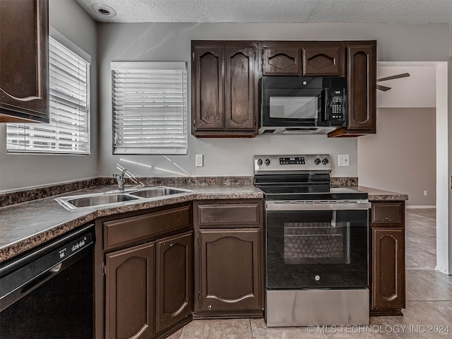 kitchen with black appliances, sink, ceiling fan, a textured ceiling, and dark brown cabinetry