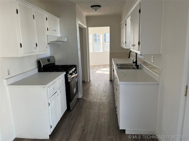 kitchen with dark hardwood / wood-style flooring, sink, white cabinets, and stainless steel gas range