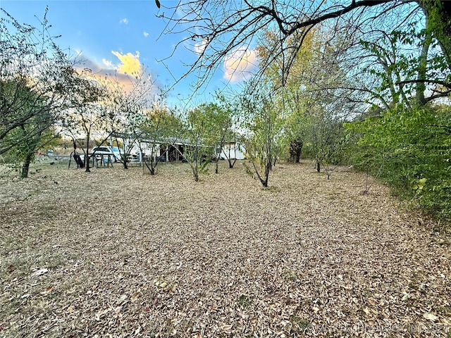 view of yard at dusk