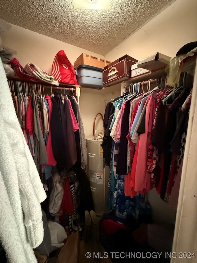 spacious closet featuring electric water heater