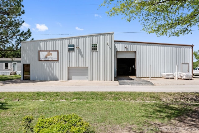 view of outbuilding featuring a yard