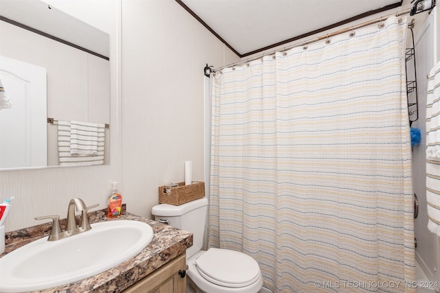 bathroom featuring a shower with shower curtain, a textured ceiling, vanity, toilet, and lofted ceiling