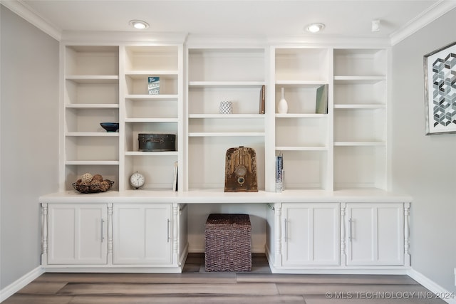 room details featuring hardwood / wood-style floors and crown molding