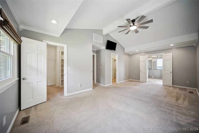 interior space featuring vaulted ceiling with beams, ceiling fan, and crown molding