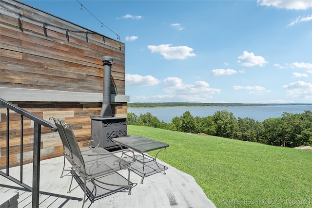 view of patio featuring a water view