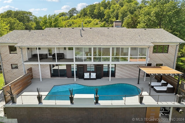 view of swimming pool featuring outdoor lounge area and a patio