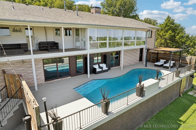 view of swimming pool with outdoor lounge area and a patio area