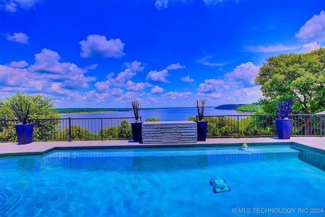 view of pool featuring a water view