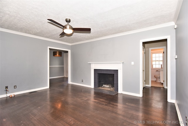 unfurnished living room featuring a textured ceiling, dark hardwood / wood-style floors, ornamental molding, and a fireplace