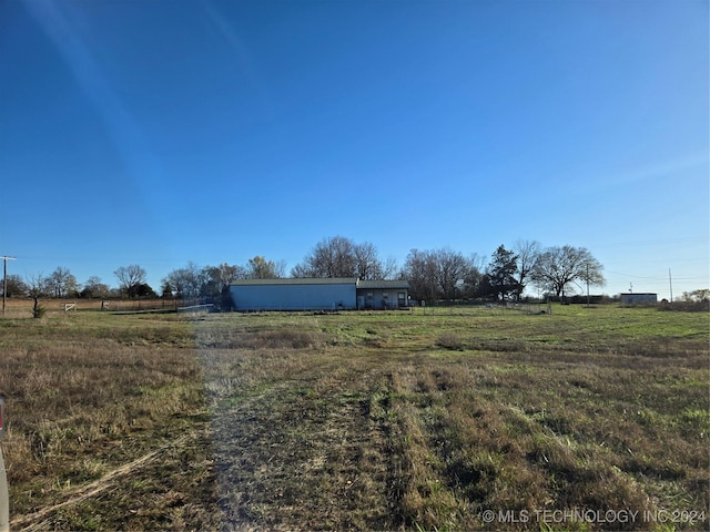 view of yard with a rural view