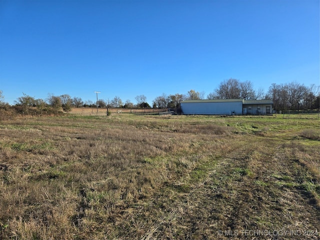 view of yard with a rural view