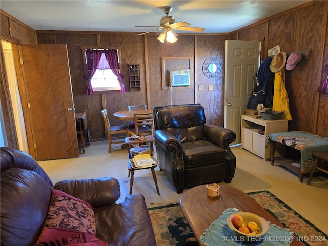 living room featuring light colored carpet, ceiling fan, and wood walls