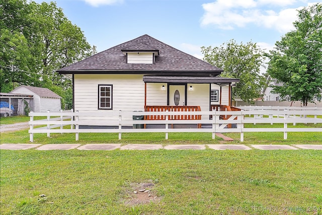 bungalow-style house with a porch and a front lawn