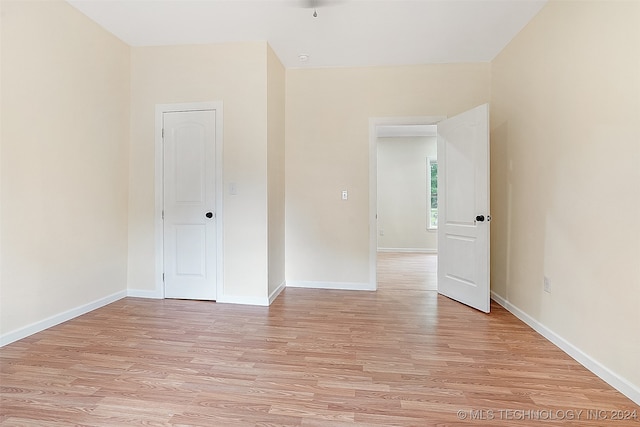 unfurnished bedroom featuring light wood-type flooring