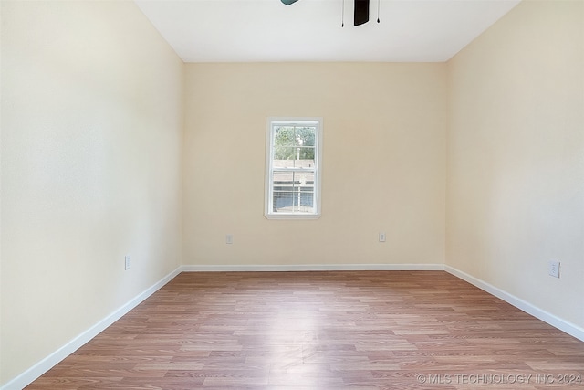 empty room featuring ceiling fan and light wood-type flooring