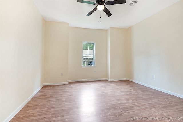 unfurnished room with ceiling fan and light hardwood / wood-style flooring