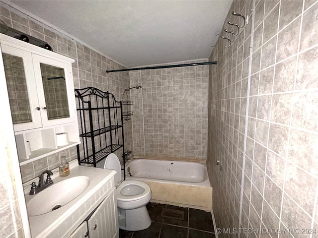 full bathroom featuring decorative backsplash, vanity, tile walls, toilet, and tiled shower / bath