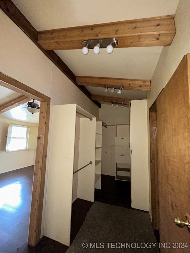 hallway featuring beamed ceiling