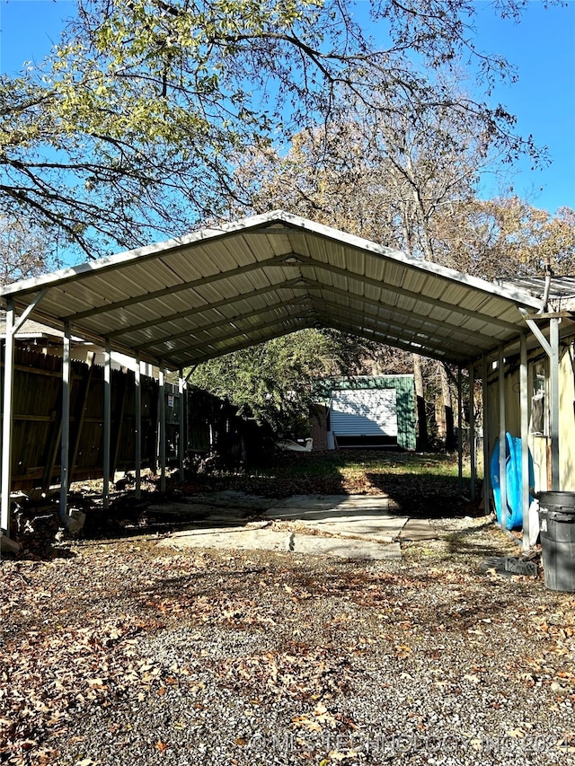 view of parking / parking lot featuring a carport