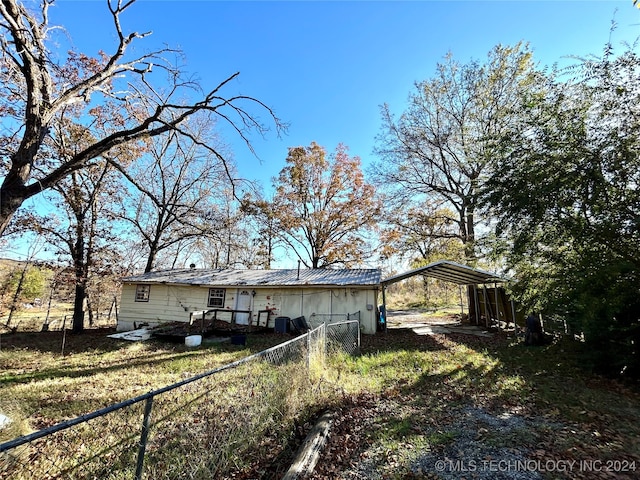 view of home's exterior featuring a carport