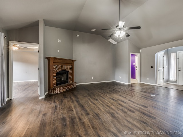 unfurnished living room featuring a fireplace, ceiling fan, dark hardwood / wood-style flooring, and vaulted ceiling