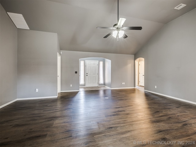 unfurnished living room featuring ceiling fan, dark hardwood / wood-style flooring, and vaulted ceiling