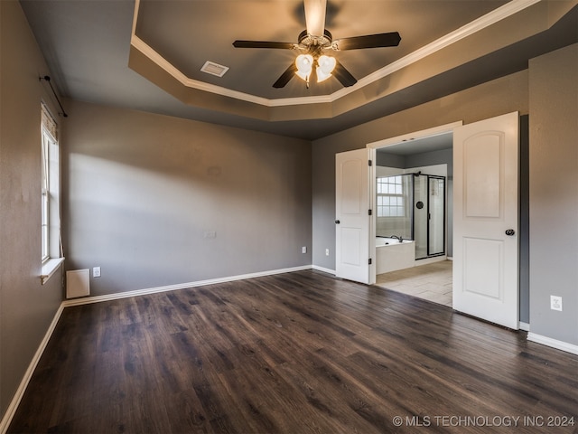 empty room featuring hardwood / wood-style flooring, ceiling fan, a healthy amount of sunlight, and ornamental molding