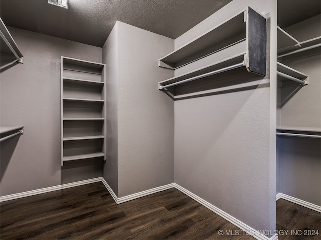 walk in closet featuring hardwood / wood-style flooring