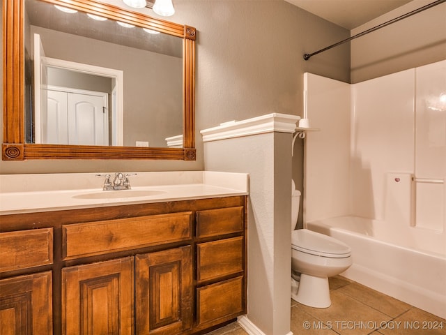 full bathroom featuring tile patterned flooring, vanity, toilet, and tub / shower combination