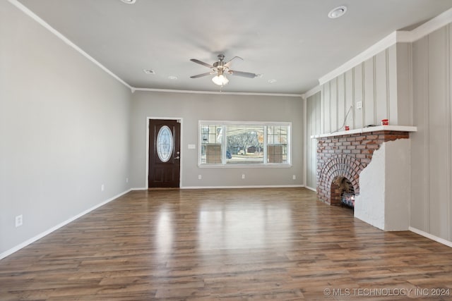 unfurnished living room with crown molding, ceiling fan, wood-type flooring, and a fireplace