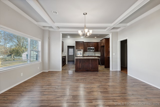 kitchen featuring appliances with stainless steel finishes, coffered ceiling, and beam ceiling