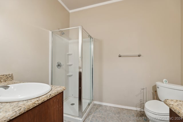 bathroom with crown molding, vanity, toilet, and an enclosed shower